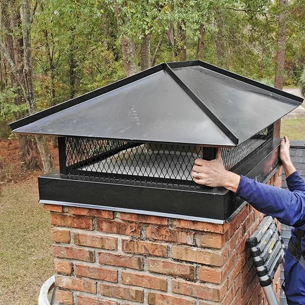 Chimney cap installation on brick chimney