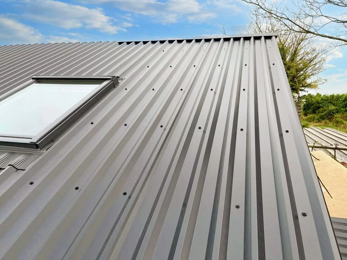 Standing seam metal roof with skylight