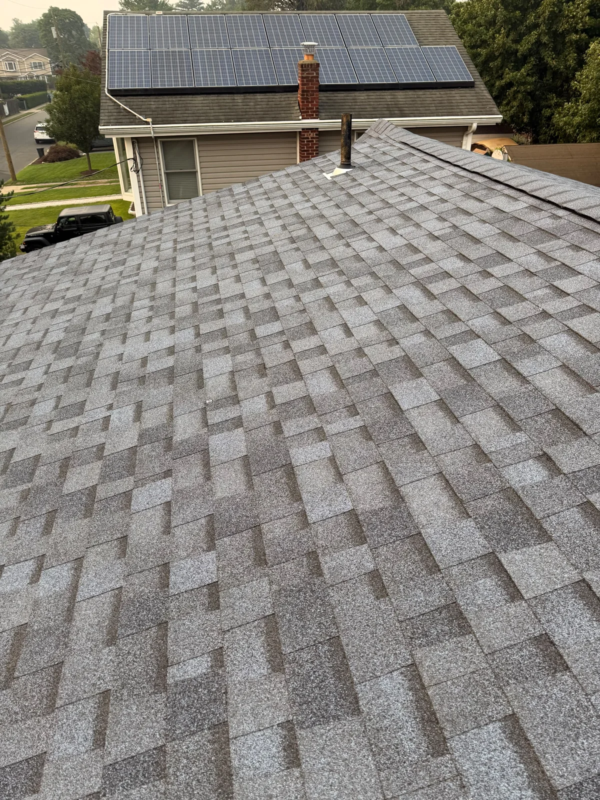Completed architectural shingle roof by Genis Construction